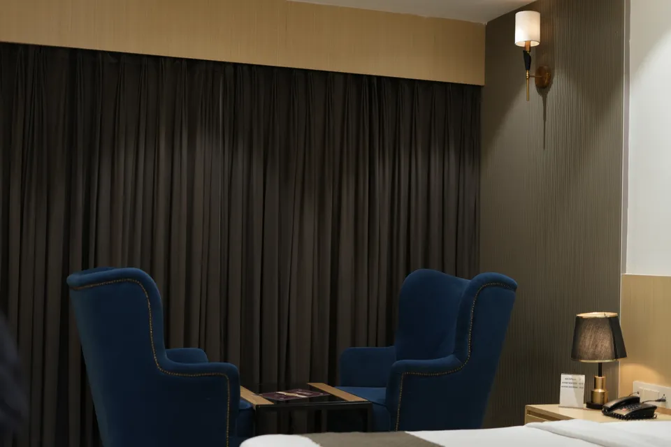 Suite seating corner with blue wingback chairs